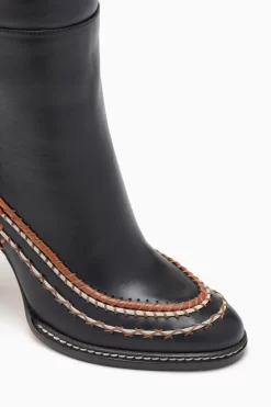 ULLA JOHNSON Arlette Knee High Boot - Noir -Fashion Haven Shop FA231013 KNEEHIGHBOOTWITHSTITCHDETAIL NOIR c r web